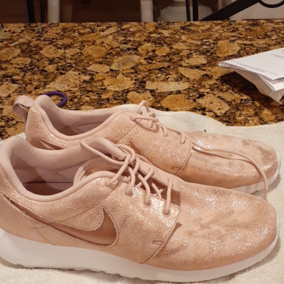 Nike Shoes - Womens Nike pink with gold shimmer